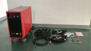 Complete set of heavy-duty drawn arc stud welder including power source, welding cables, two hand guns, and assorted chucks for industrial construction.