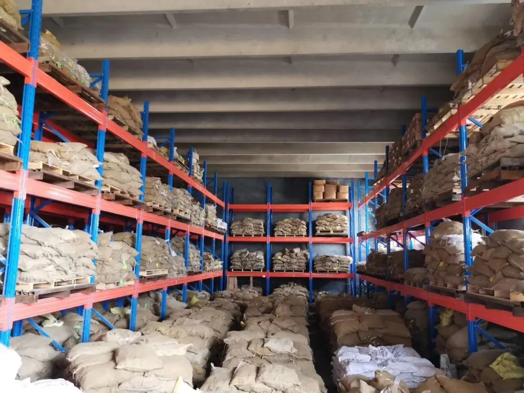 Large-scale warehouse inventory of ZOC shear studs and ceramic ferrules in bulk bags.