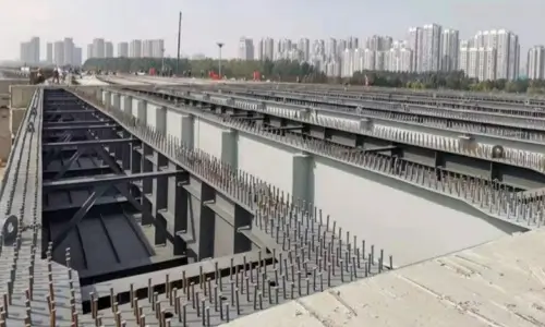 Row of shear studs welded on top of steel bridge girders ready for composite concrete slab